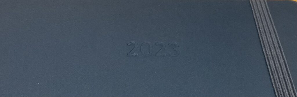 Cover of Blue Moleskine embossed witn 2023